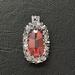 Orange oval-shaped crystal is approx. 25mm x 16mm surrounded by Swarovski Elements Crystals and seed beads. 